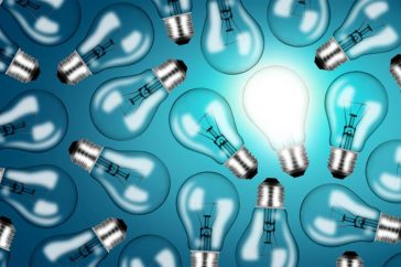 many-lightbulbs-on-blue-background–ideas-and-creativity-concept